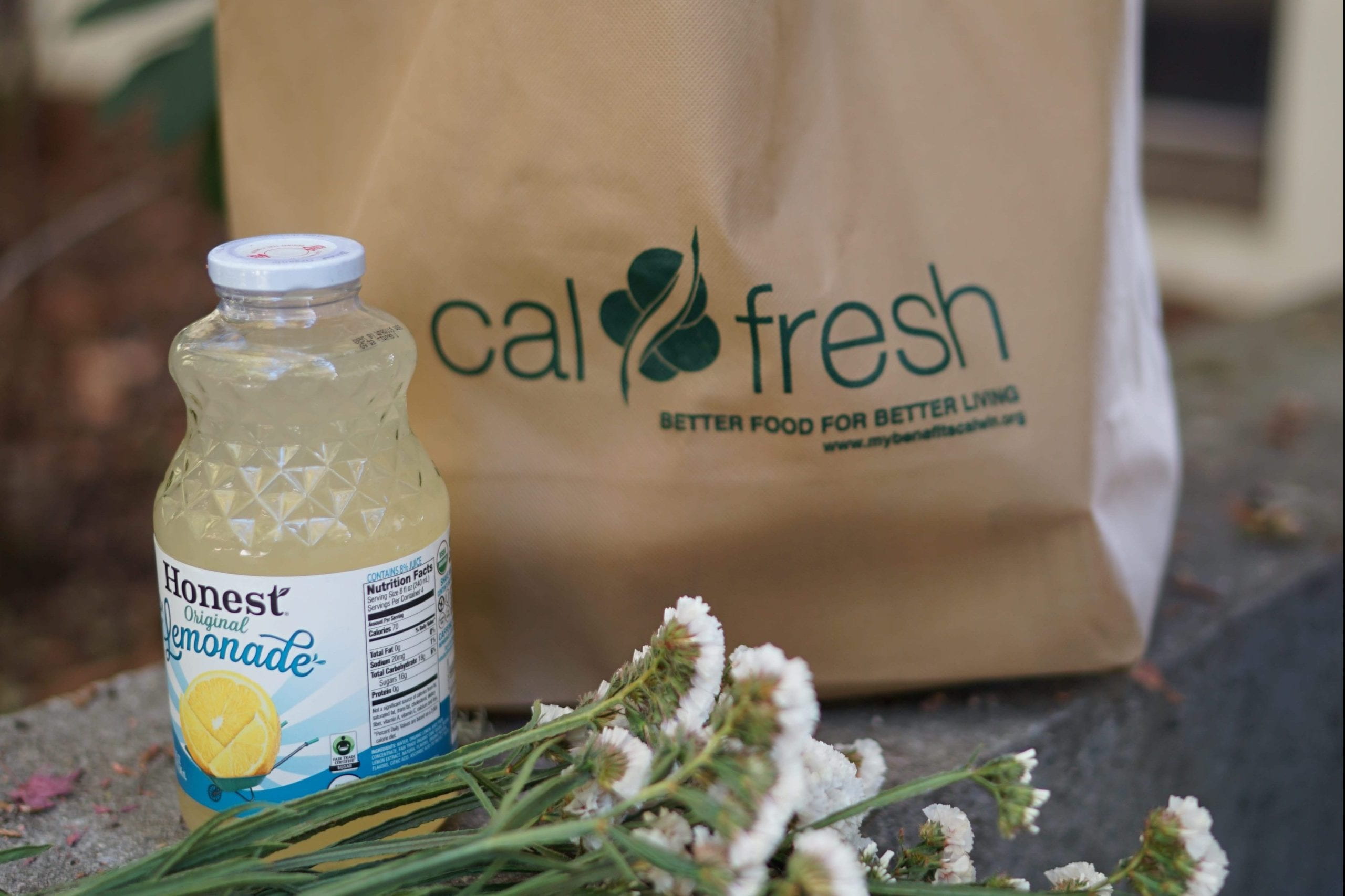 calfresh bag with lemonade and flowers in front 